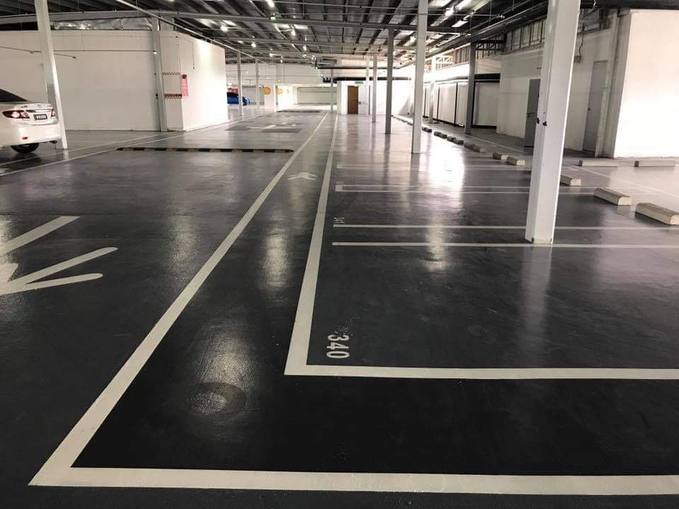 Charcoal car-park deck with bay lines: epoxy deck coating, charcoal